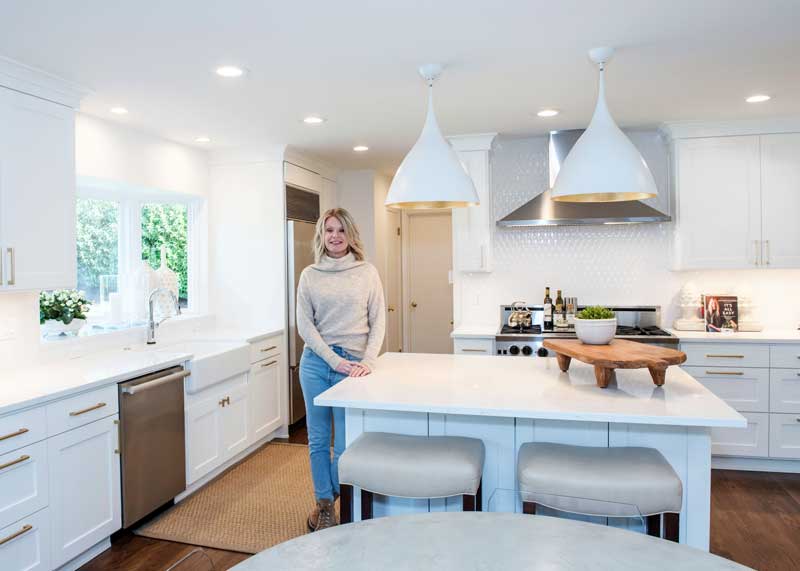 Shannon Landry in a kitchen Landry & Co designed and remodeled